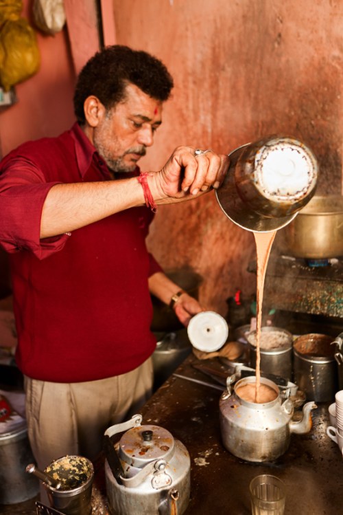 Indian street seller selling tea - masala chai