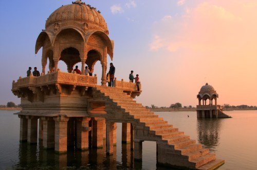 Gadi Sagar temple on Gadisar lake at sunset, Jaisalmer, India